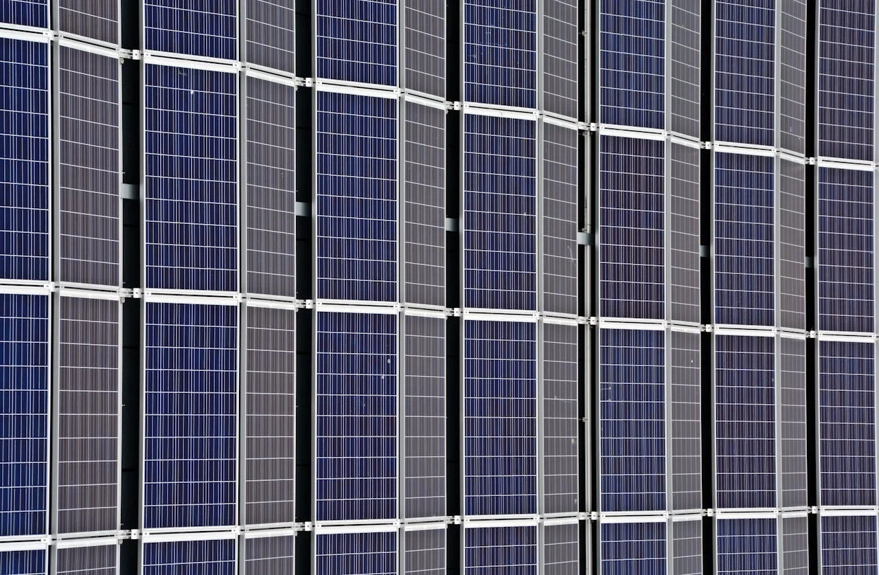 Close-up of multiple solar panels representing renewable energy and sustainability.